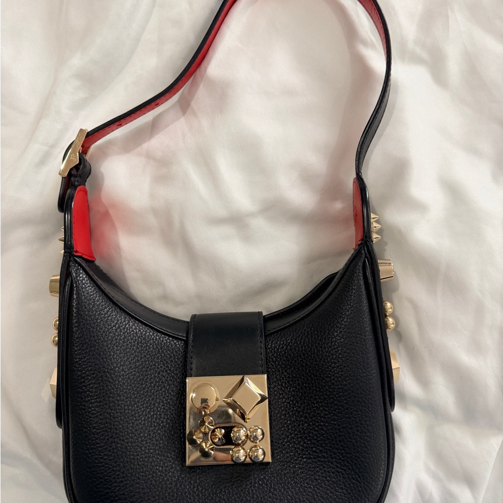 CHRISTIAN LOUBOUTIN
Carasky black mini